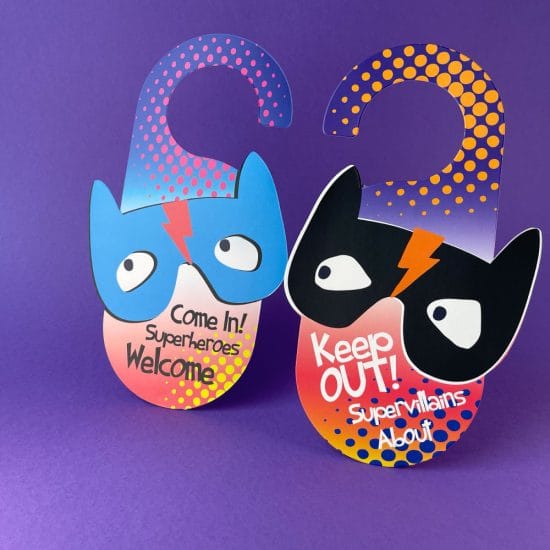 Double-sided cardboard superhero door hanger with 'Come in, Superheroes, Welcome' and 'Keep Out, Super Villains About' text; a plastic-free party bag filler