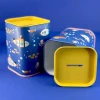2 Ocean-themed money boxes one with lid removed.